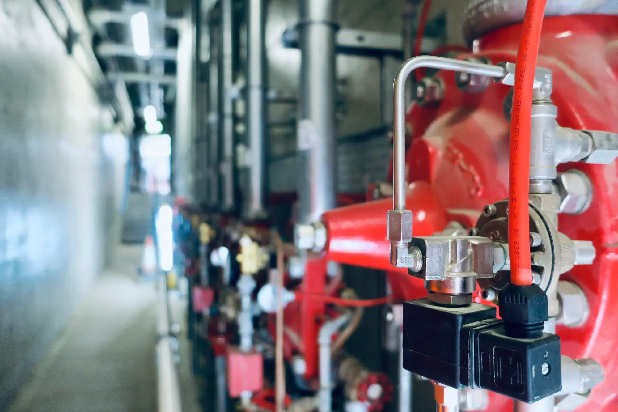 Commercial building pipework and control valves — the kind of system VeriTech Plumbing installs and maintains across Orange County
